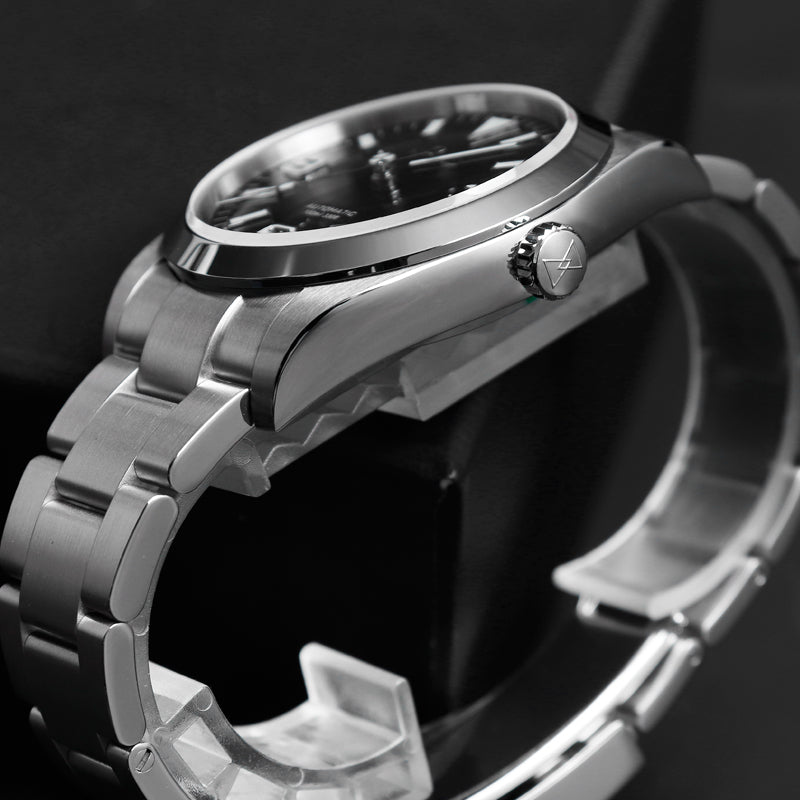 Side view of a Cronos L6019 showing the crown, curved lugs and bracelet end link